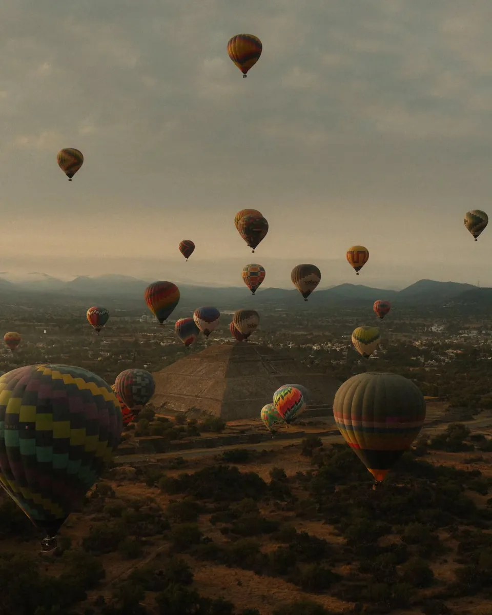 Hot air balloons over the farmland that surrounds the Teotihuacan archaeological zone at dawn