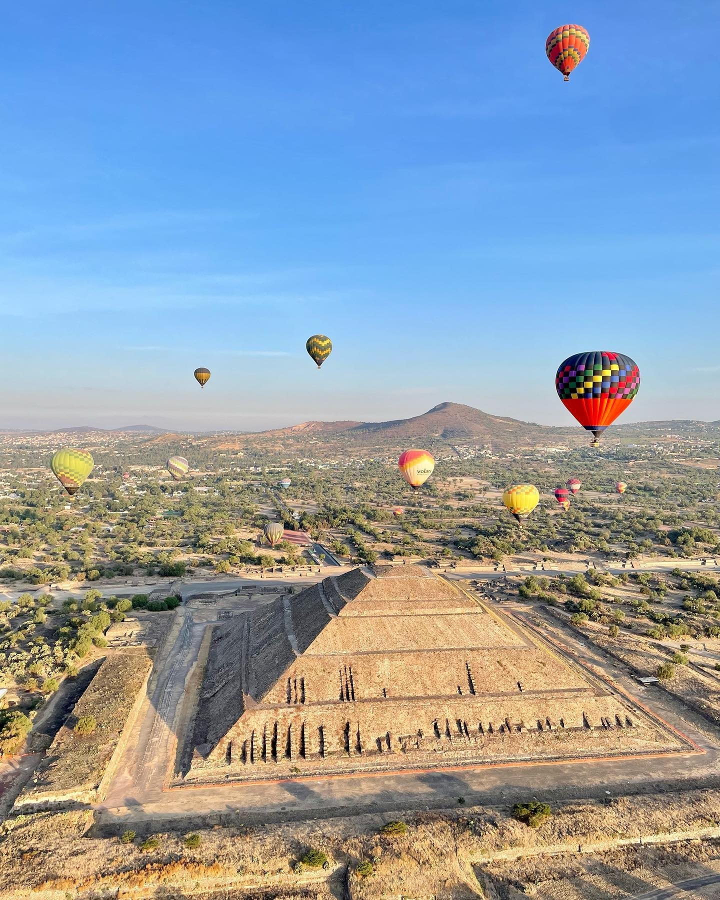 The Pyramid of the Sun seen from a hot air balloon, with the Avenue of the Dead running north